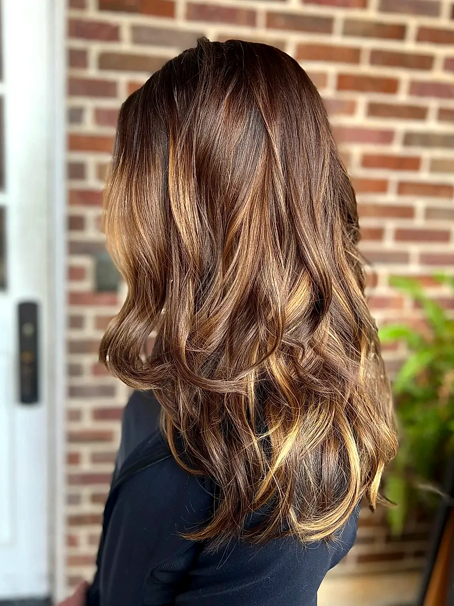 Long brunette hair with caramel balayage highlights
