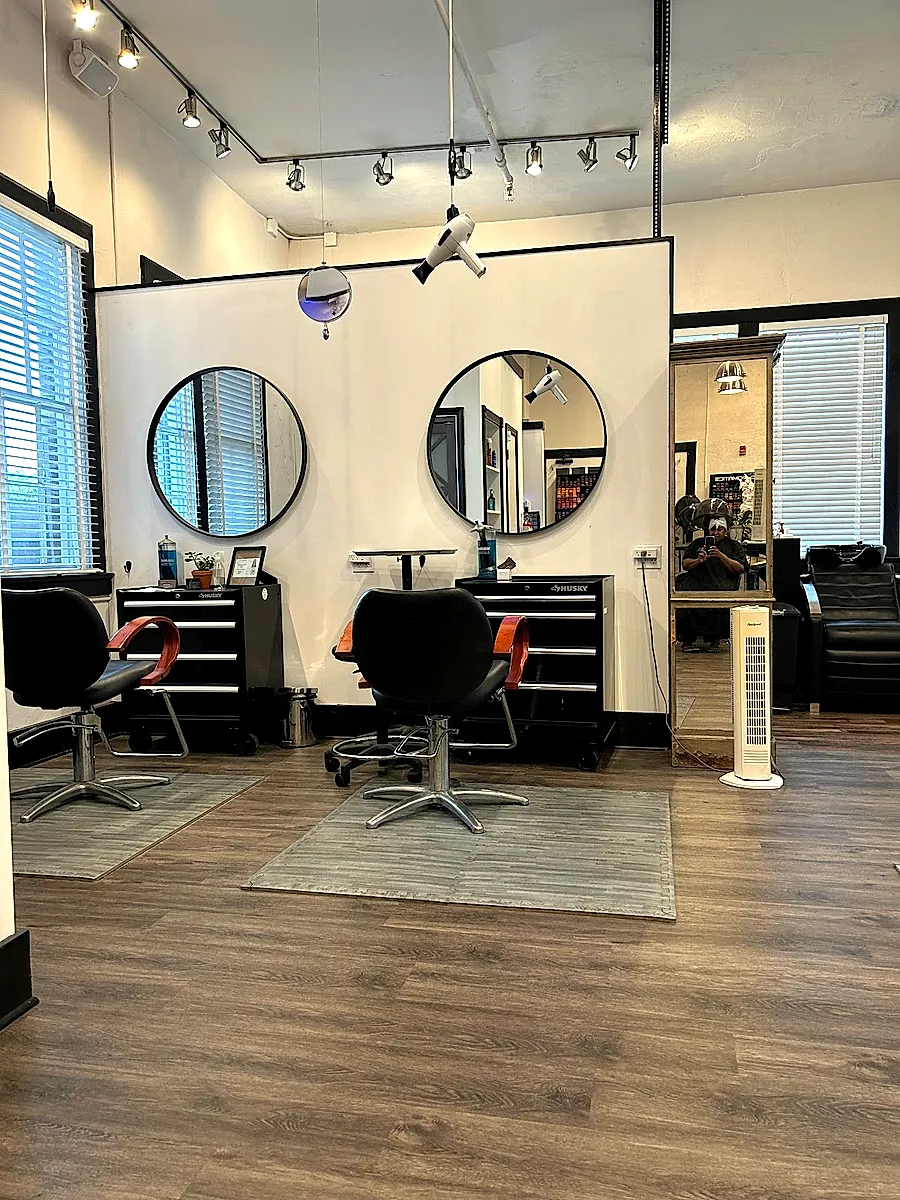 Bright Smoak Salon styling floor with round mirrors